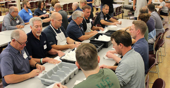 SDN Employees prepare silverware at The Banquet