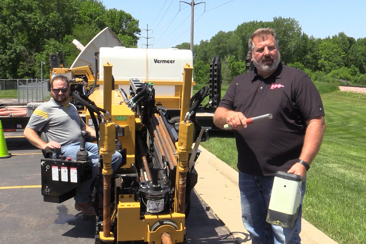 Brad Engbarth standing with a directional borer drills for fiber conduit installation