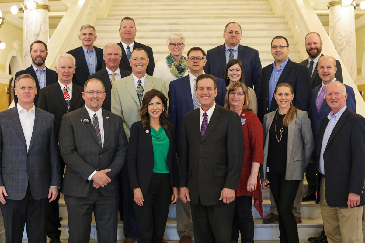 group photo following the signing of Senate Bill 34