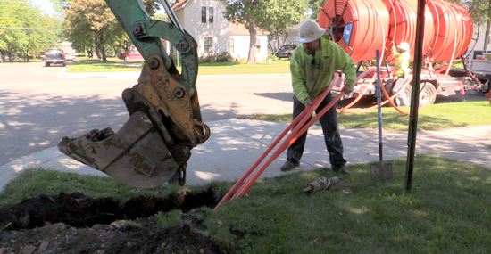 putting fiber conduit into the ground