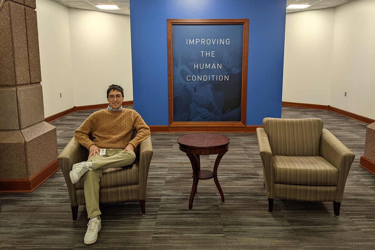 Danial Madson poses for a feature on a couch in the Sanford Health building