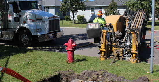 Crews drilling to place fiber in the ground