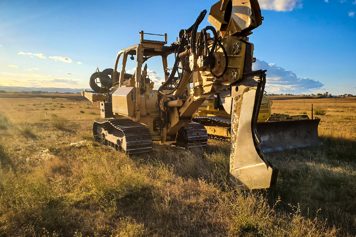 Fiber plow used to plant fiber optic lines into the ground