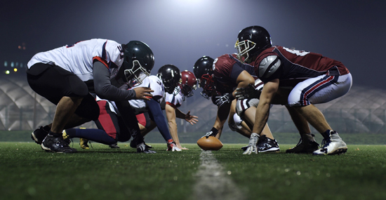 Football players ready for the snap