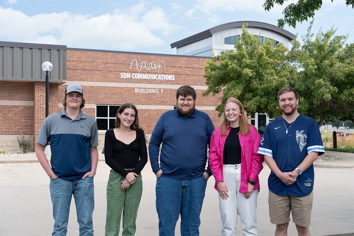 SDN Communications interns pose for a photo outside of the Sioux Falls office