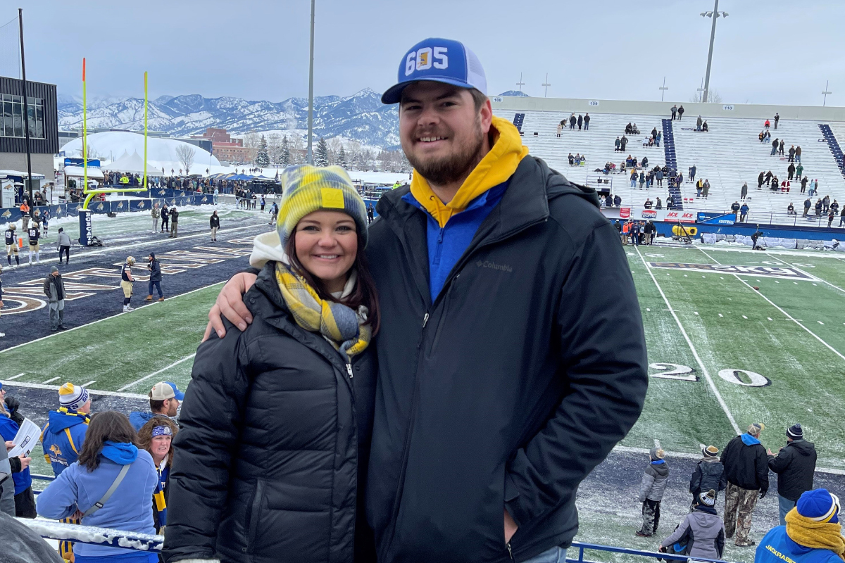 Megan and Grant Greenfield at a college football game