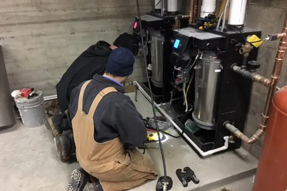 men working on equipment for Midwestern Mechanical