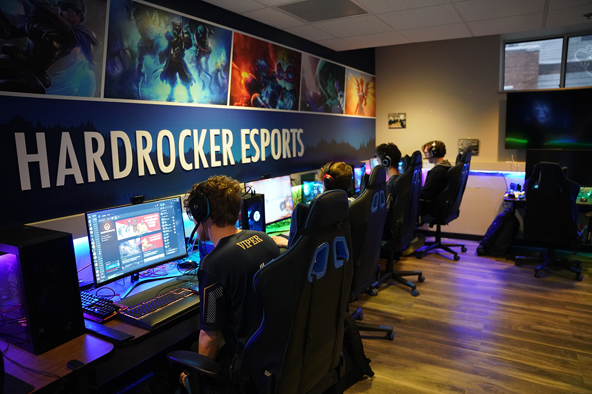 Students from South Dakota Mines sit in front of computers in the college's esports room.