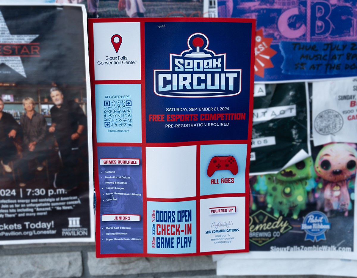 A poster for the SoDak Circuit esports event hangs on a wall at a Sioux Falls business.