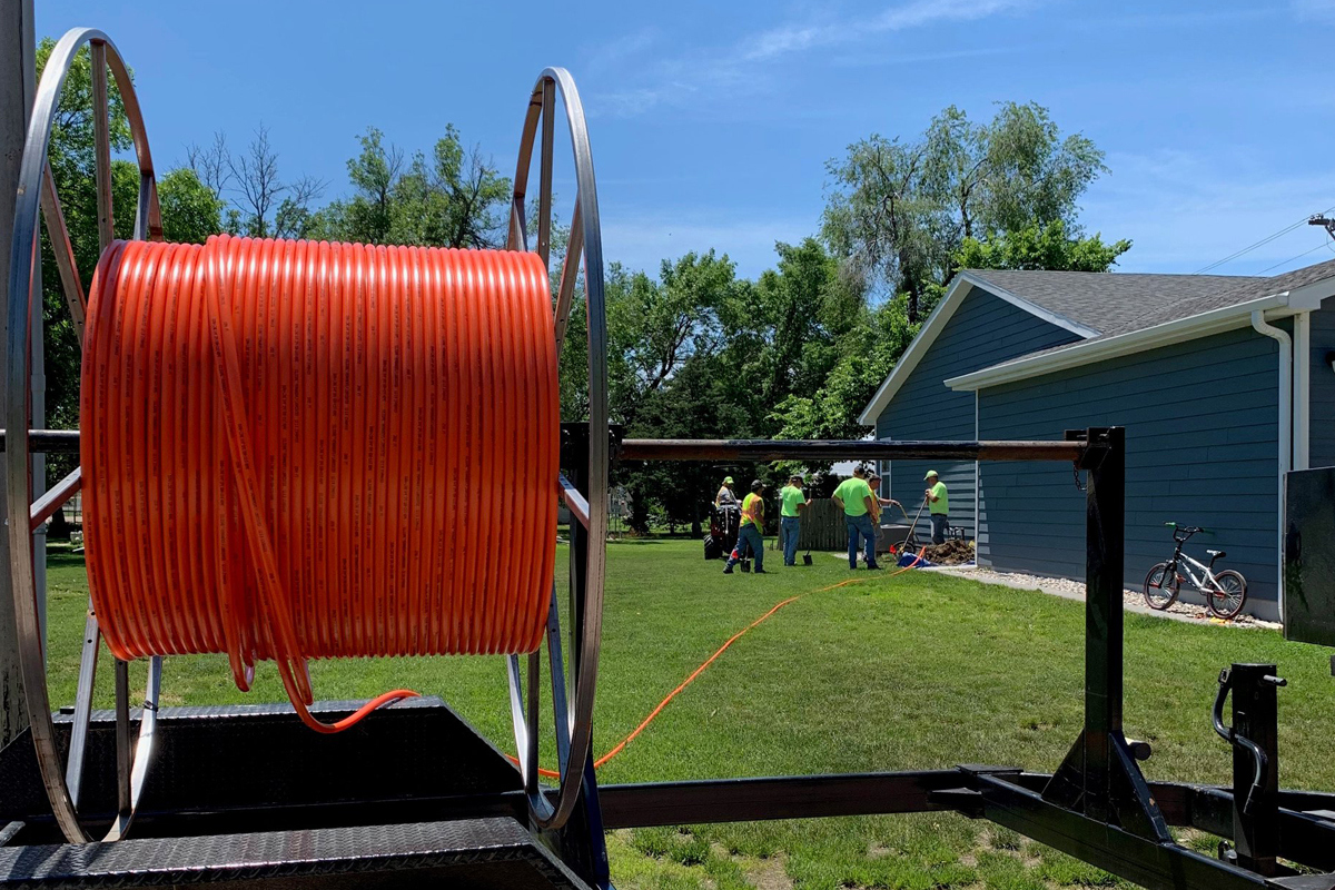 Large roll of fiber conduit at a home where fiber is being installed