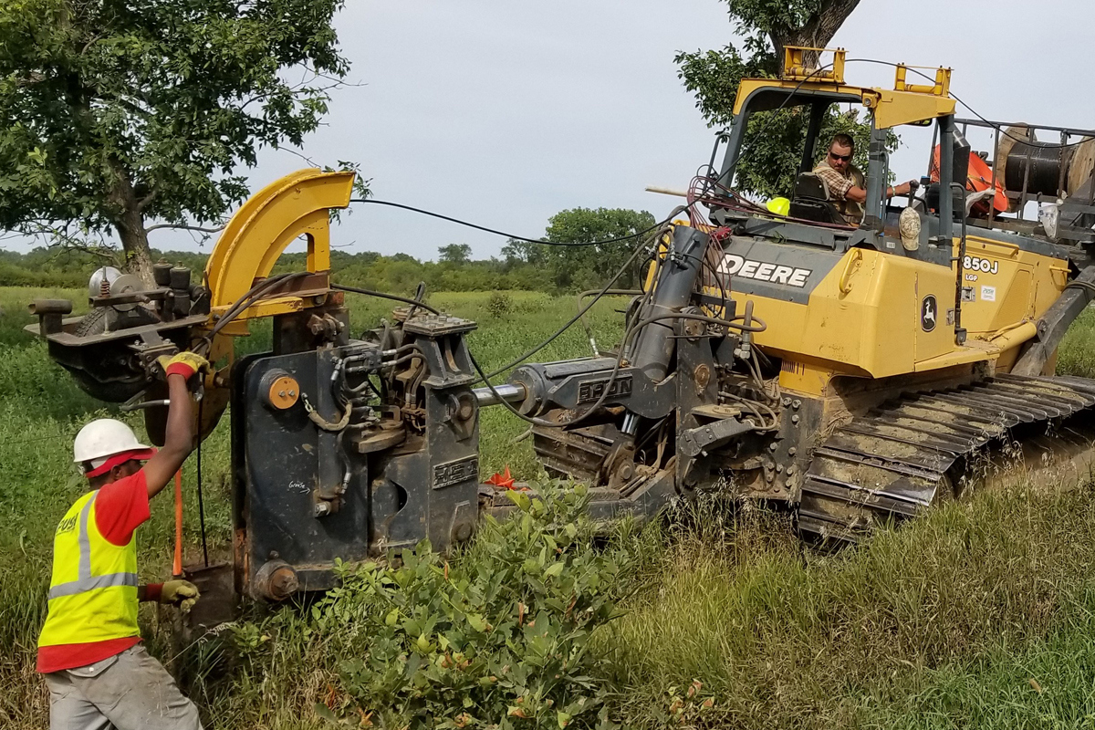 Workers dig in fiber for Santel Communications in this file photo.