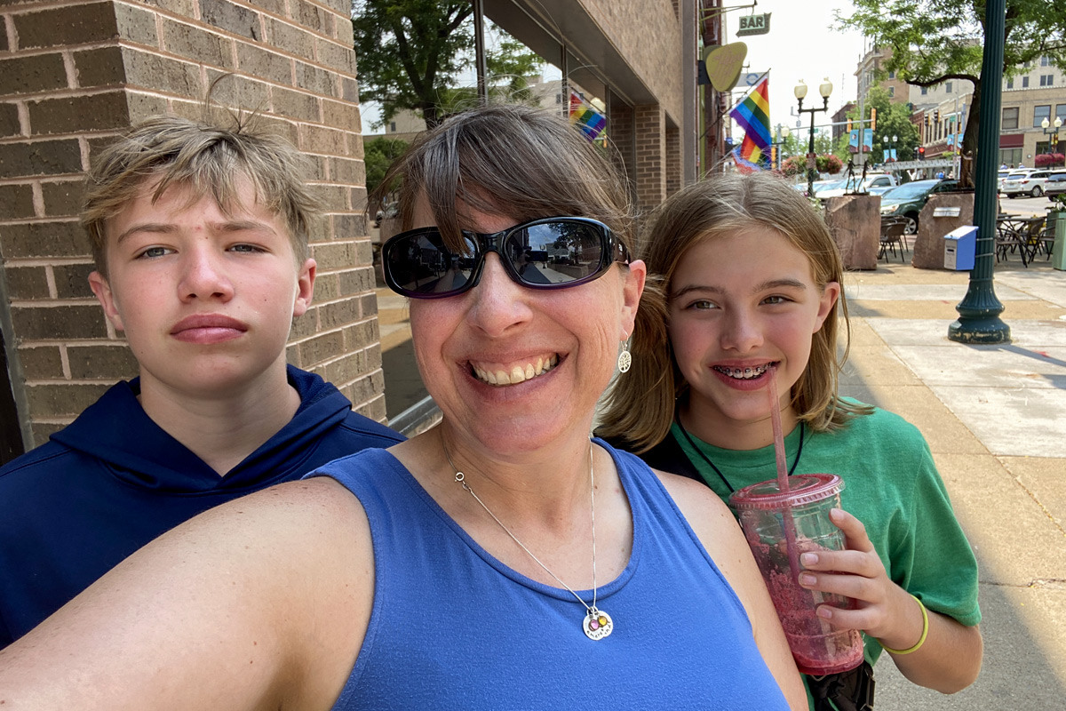 Selfie of Amy with her son and daughter downtown