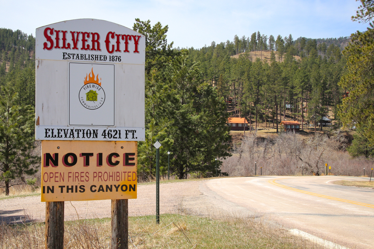 Silver City limits sign alongside road