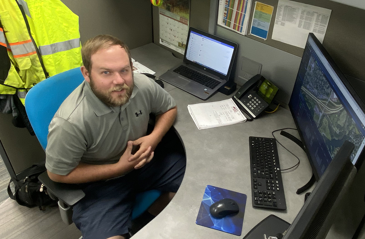 Tyler Larson examines SDN Communications fiber internet equipment in Sioux Falls, South Dakota.