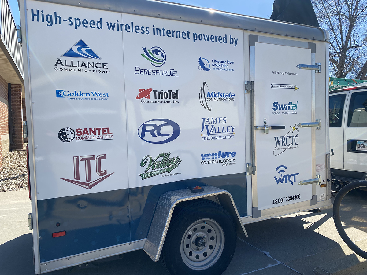 Logos on the side of the SDN Communications wifi trailer