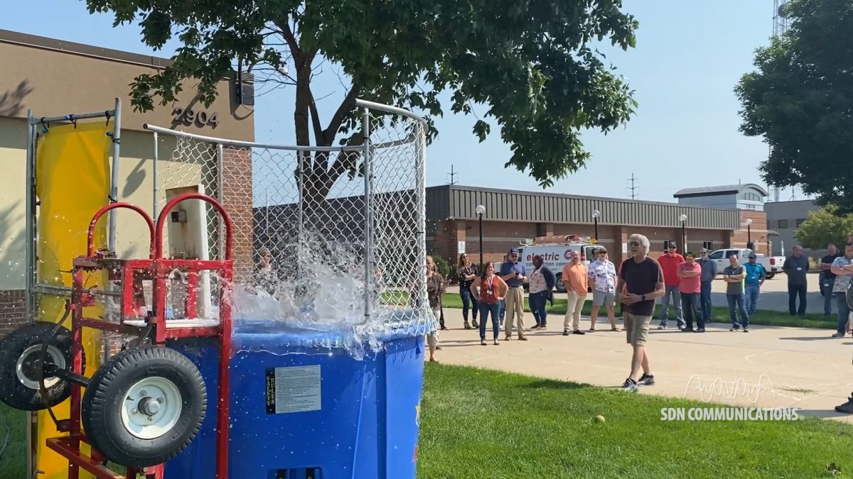 VP of sales making a splash as he's dunked into the tank of water