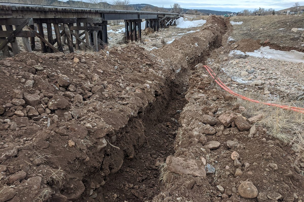 Fiber conduit installation through cobblestone in Sturgis