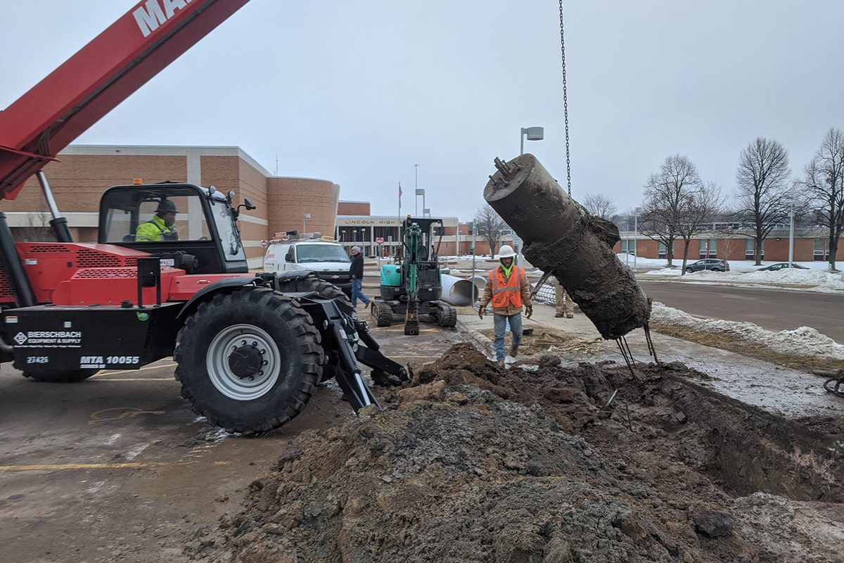 Light pole base removal at Lincoln High School