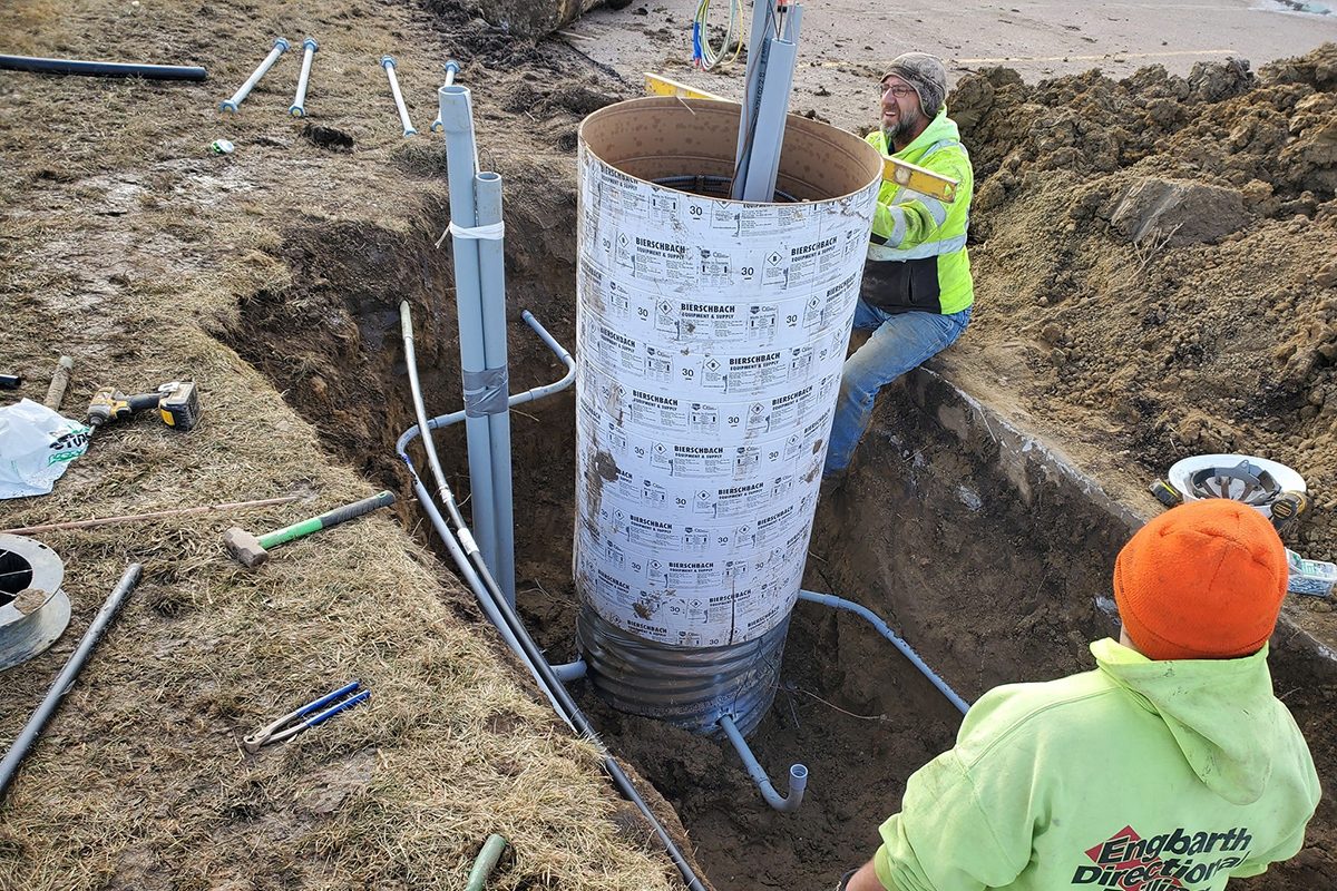 Crews working on the base for small cell poles at Washington High School in Sioux Falls