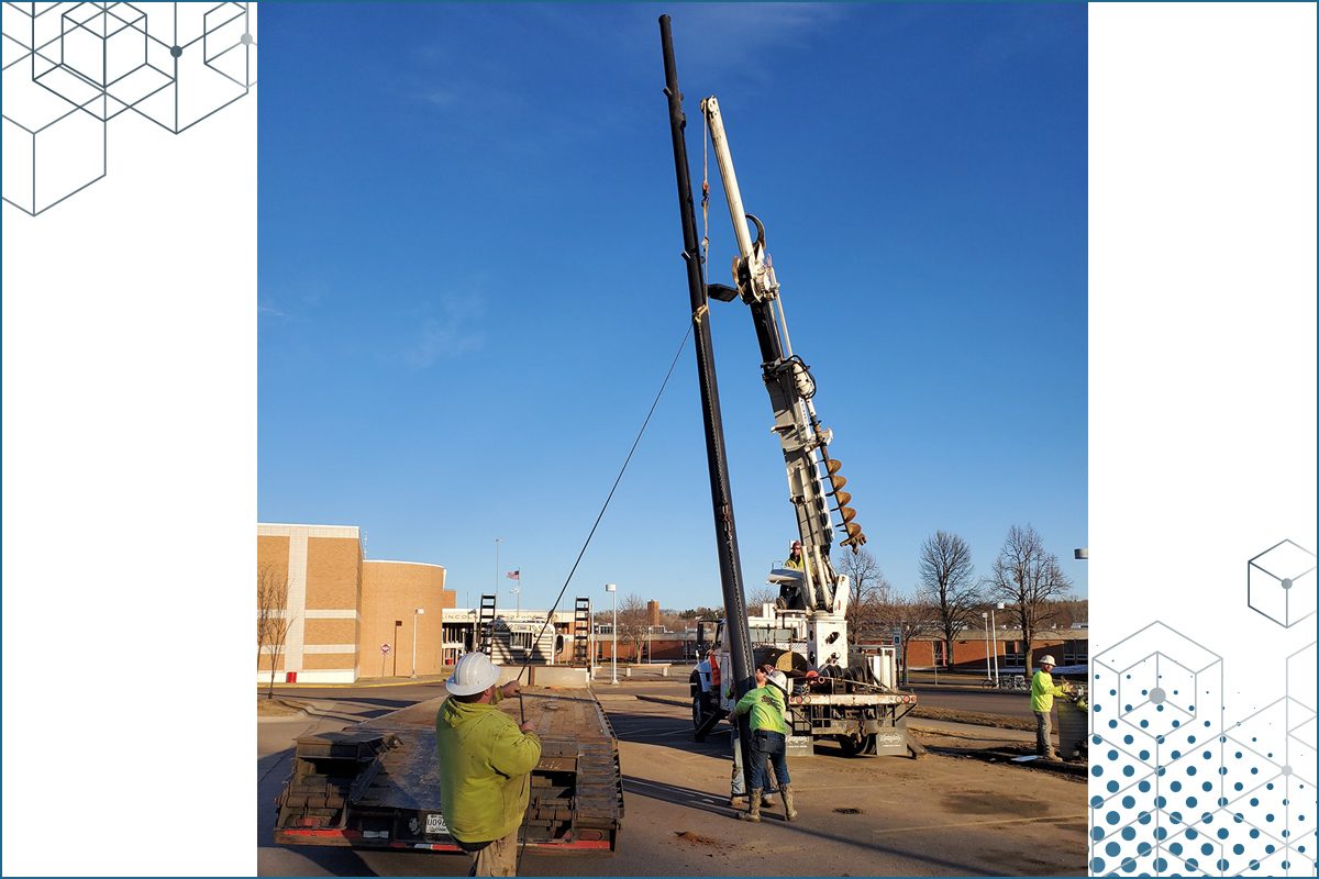 Standing up new small cell pole at Lincoln High School