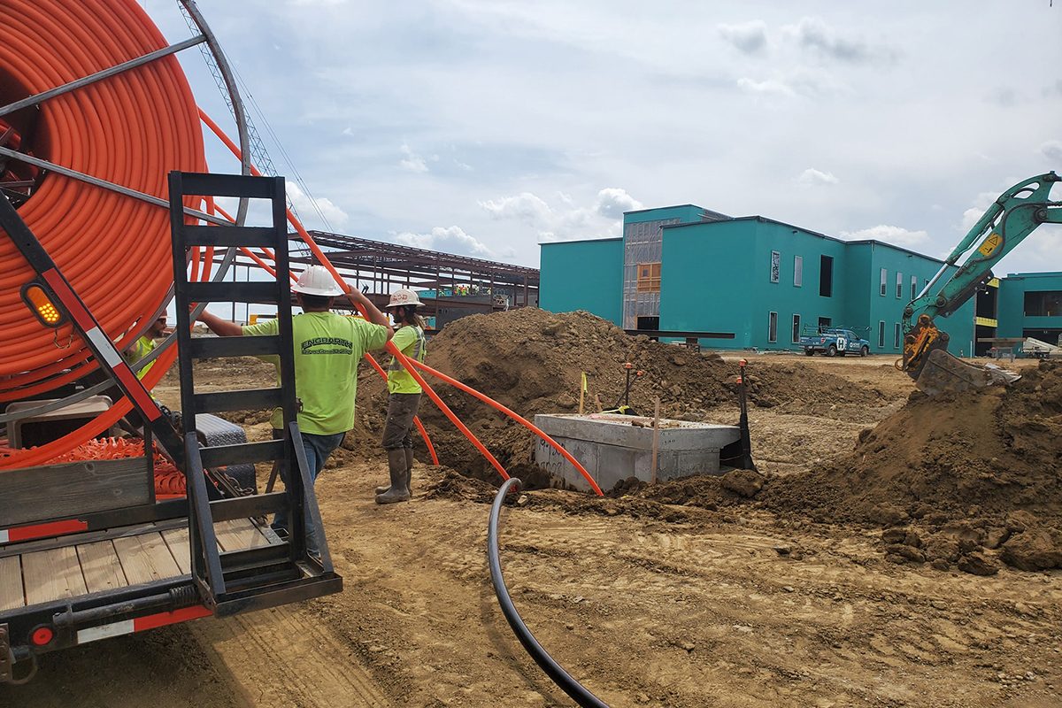 Crews installing fiber conduit at Jefferson High School Construction Site in Sioux Falls