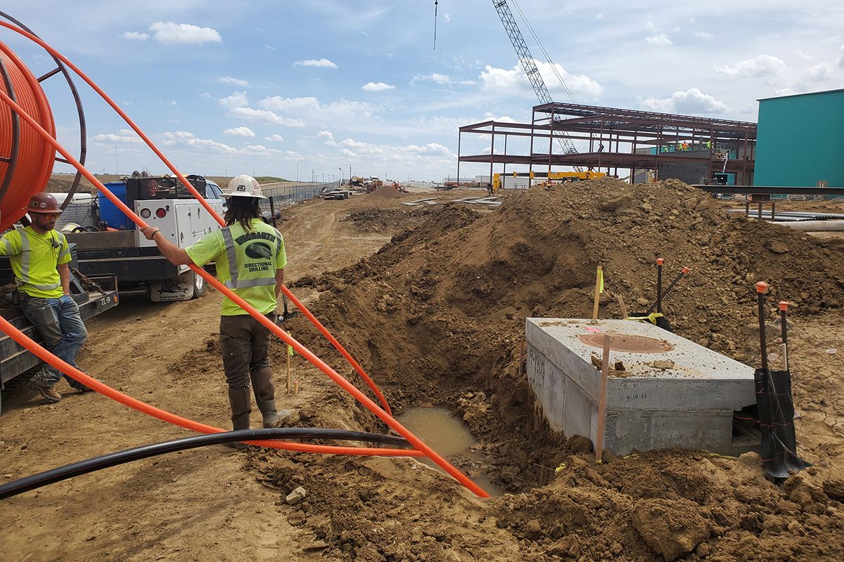 Crews installing fiber conduit at Jefferson High School Construction Site in Sioux Falls
