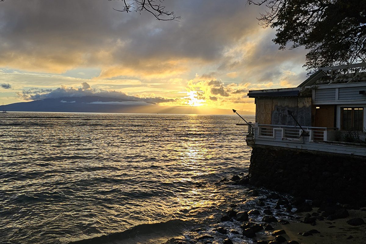 The sun sets on a beach at Lahaina in Hawaii