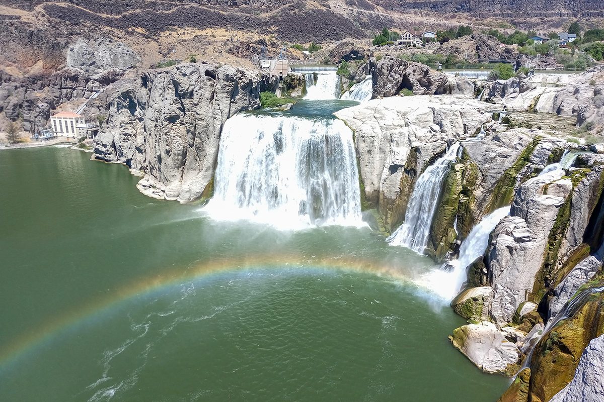A rainbow is shown over a waterfall in Idaho.