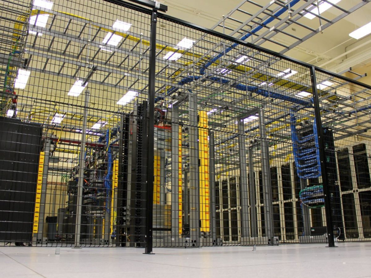 Servers are shown on racks in a data center.