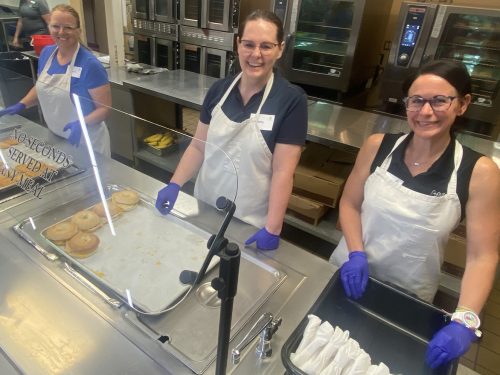 Three SDN Communications employees work at the Banquet mission providing meals to the homeless in Sioux Falls