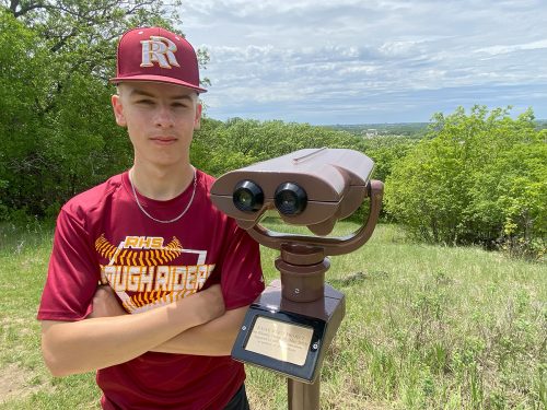 A high school student stands in front of a viewfinder at Great Bear Recreation Park in Sioux Falls